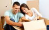 Couple Looking At Contents of Moving Box