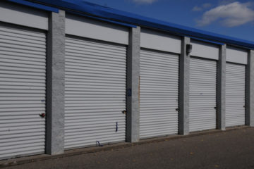 Secure, outdoor storage units with white doors