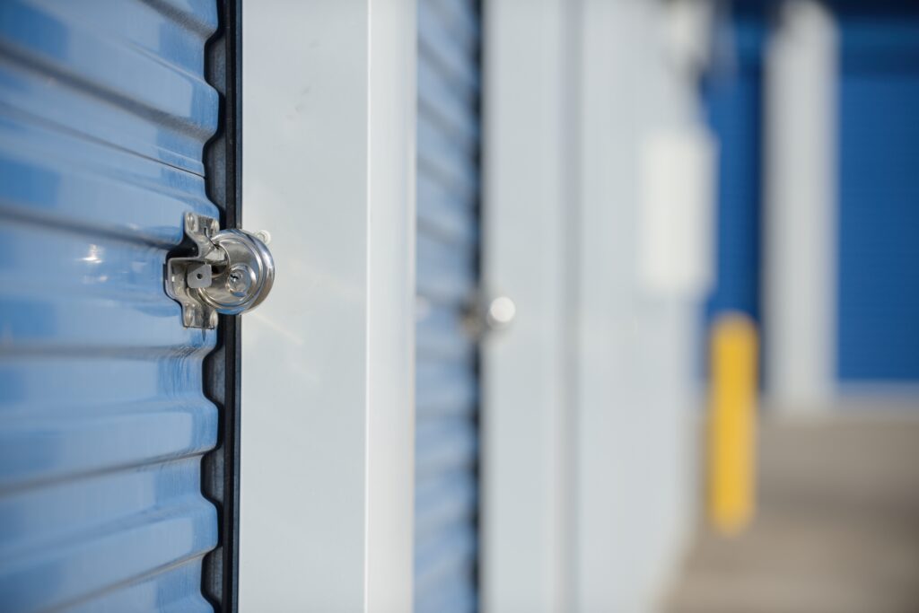 Close up view of a lock on an outdoor storage unit.