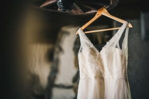 Wedding dress on hanger in dark room