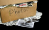 A box of sentimental photos of a deceased loved one.