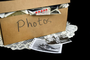 A box of sentimental photos of a deceased loved one.