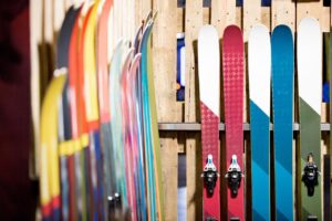 Skis lined up for use under the sun.